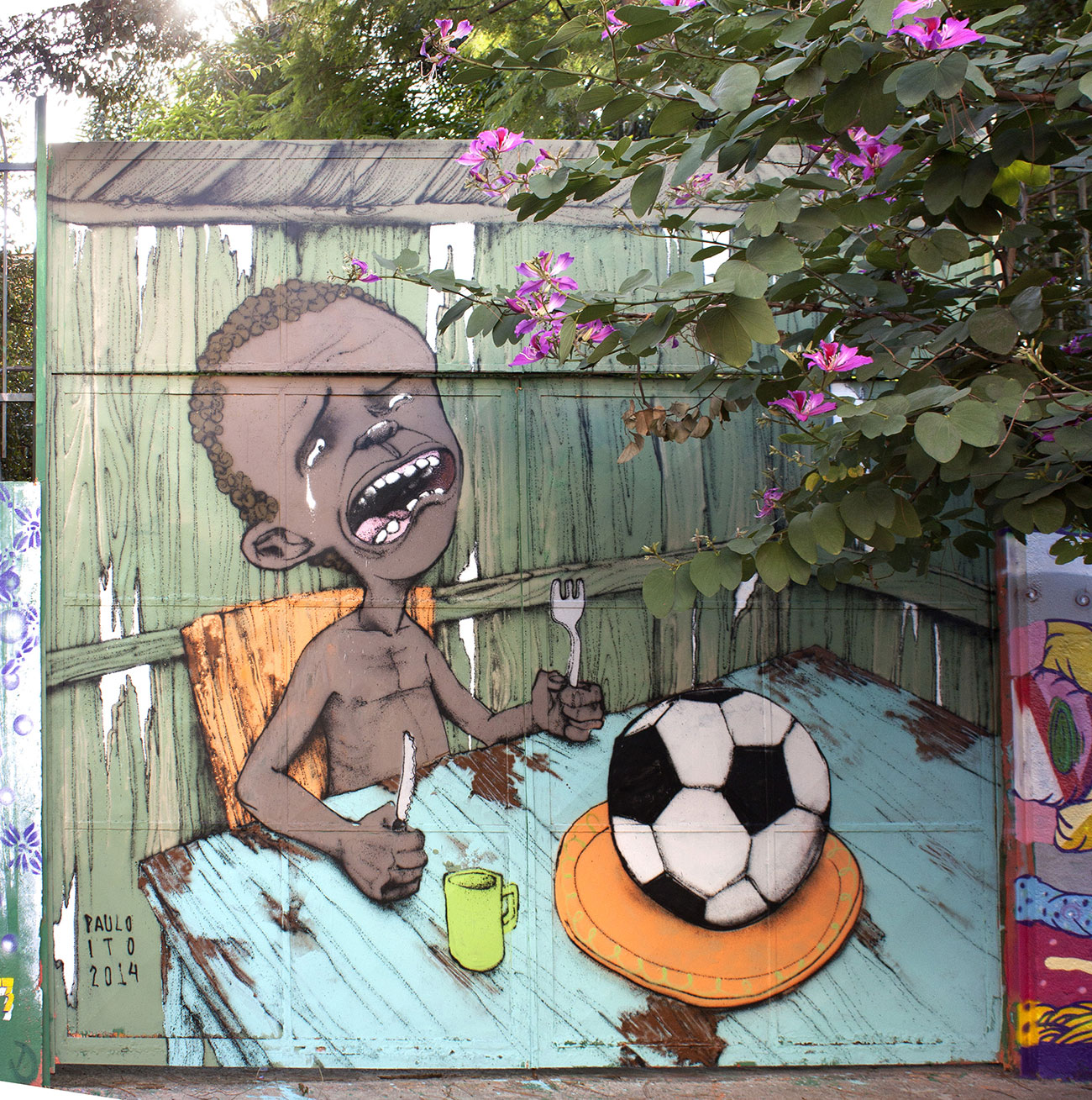 Paulo Ito, Graffiti Mondial Rio - Starving boy with football, Sao Paulo, Brésil, 2014 © Paulo ito